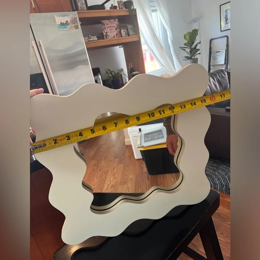 Small wavy cut mirror. Cream color. Like new.